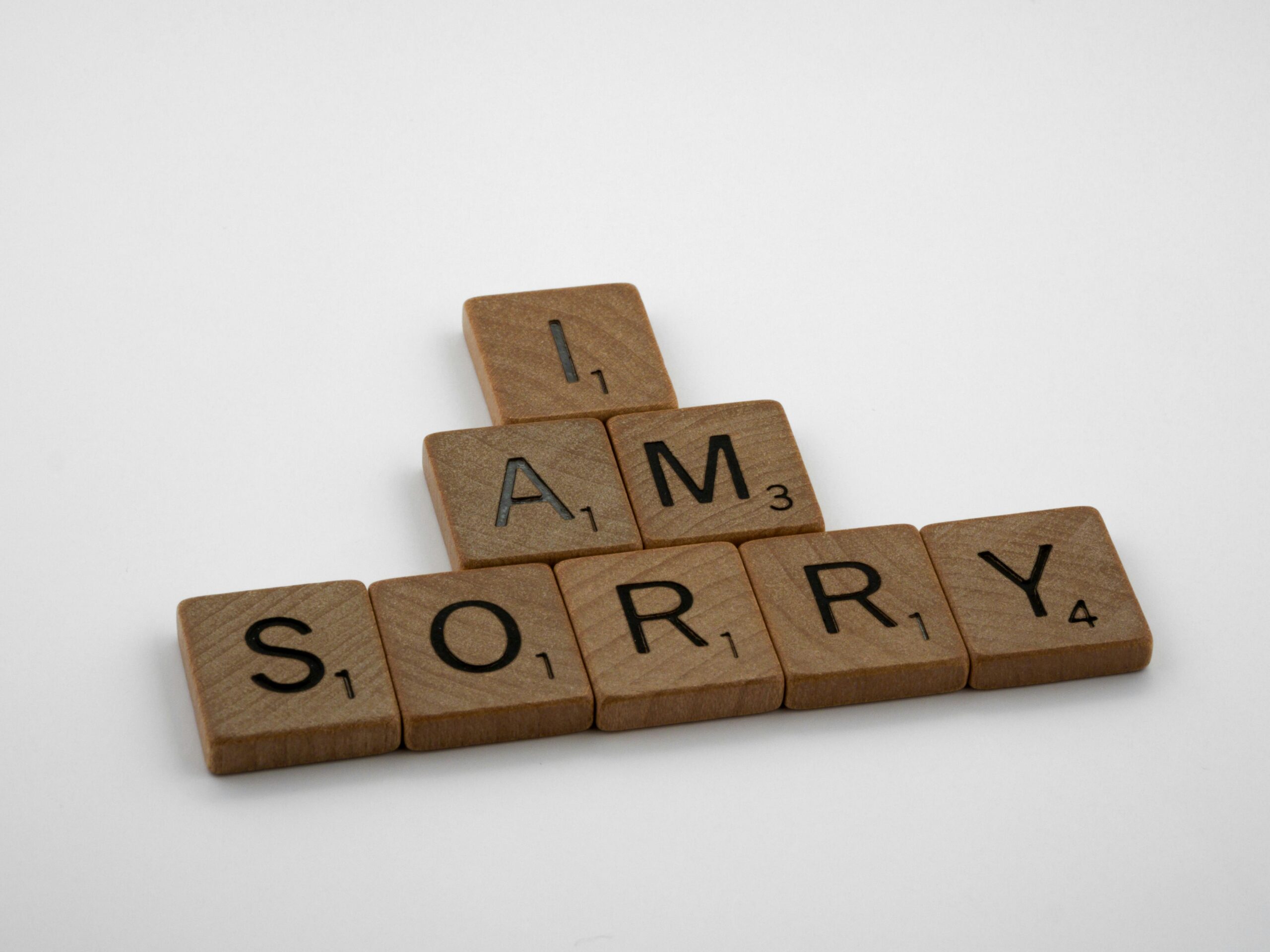Scrabble tiles spelling, "I am sorry."